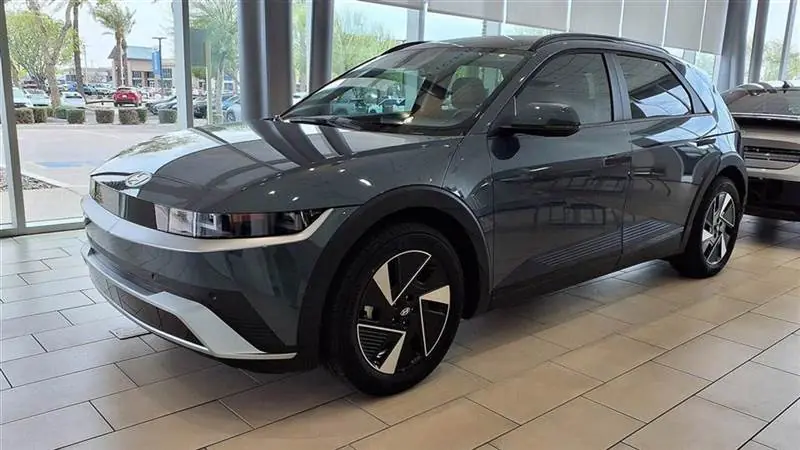 A 2025 Hyundai Ioniq 5 SEL, the refreshed model with restyled bumpers, parked at a Hyundai dealership in Gilbert, Arizona