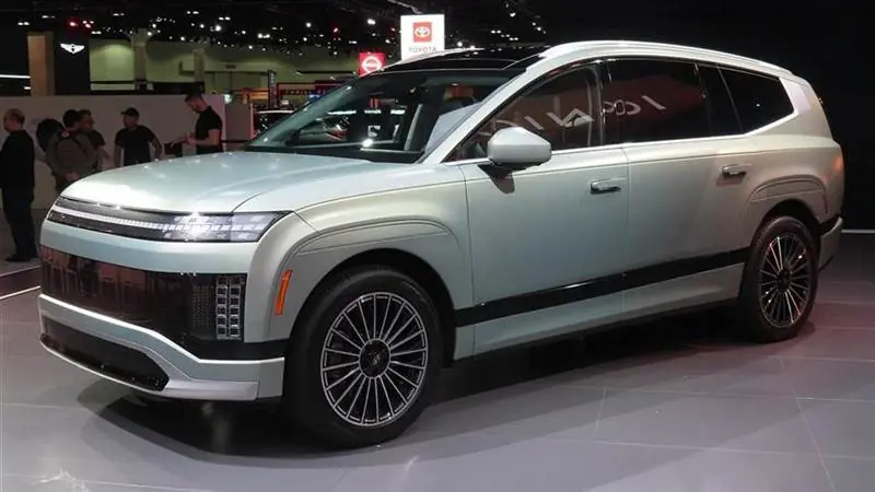 A Hyundai Ioniq 9 electric SUV displayed indoors at an auto show.