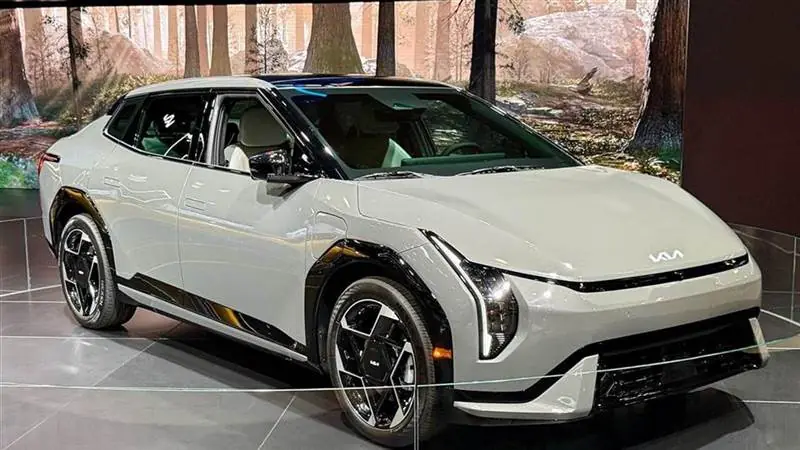 A gray 2026 Kia EV4 sedan photographed at the New York International Auto Show