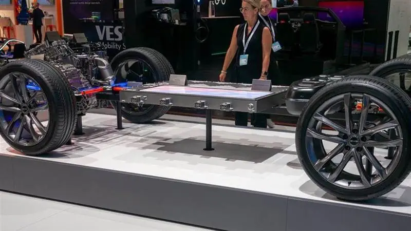 Electric vehicle chassis and battery platform displayed at IAA Summit 2023 in Munich.